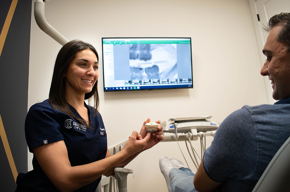 dentist demonstrating with patient